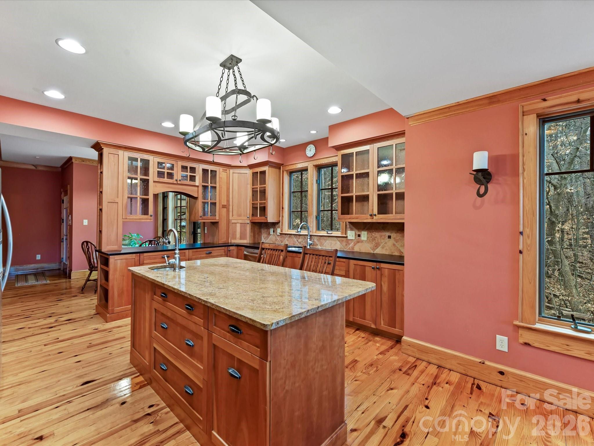 4312 Hazel Street Terrell, NC 28682 - Photo 11 of 45 a kitchen with stainless steel appliances granite countertop a kitchen island a stove and a sink