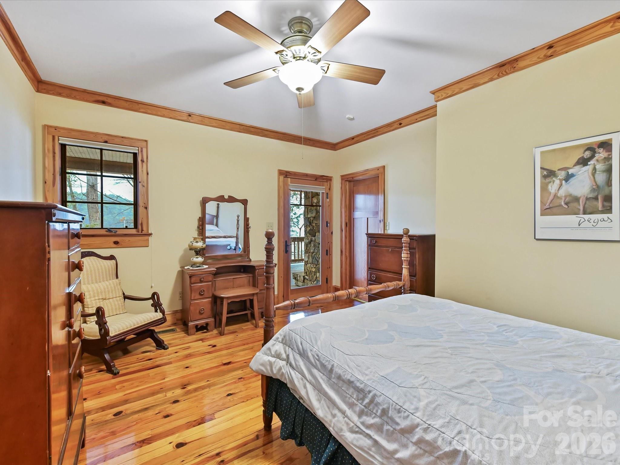 4312 Hazel Street Terrell, NC 28682 - Photo 21 of 45 a bedroom with a bed and wooden floor