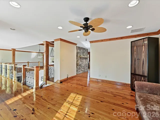 a view of workspace with wooden floor and windows