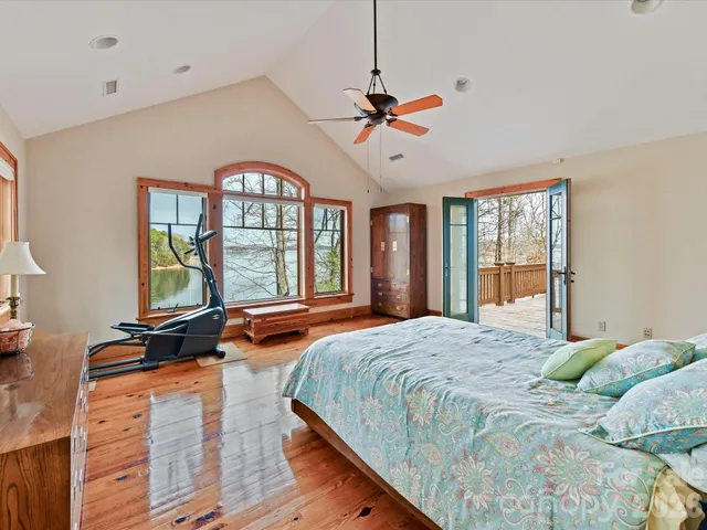 a view of a patio with table and chairs and wooden floor