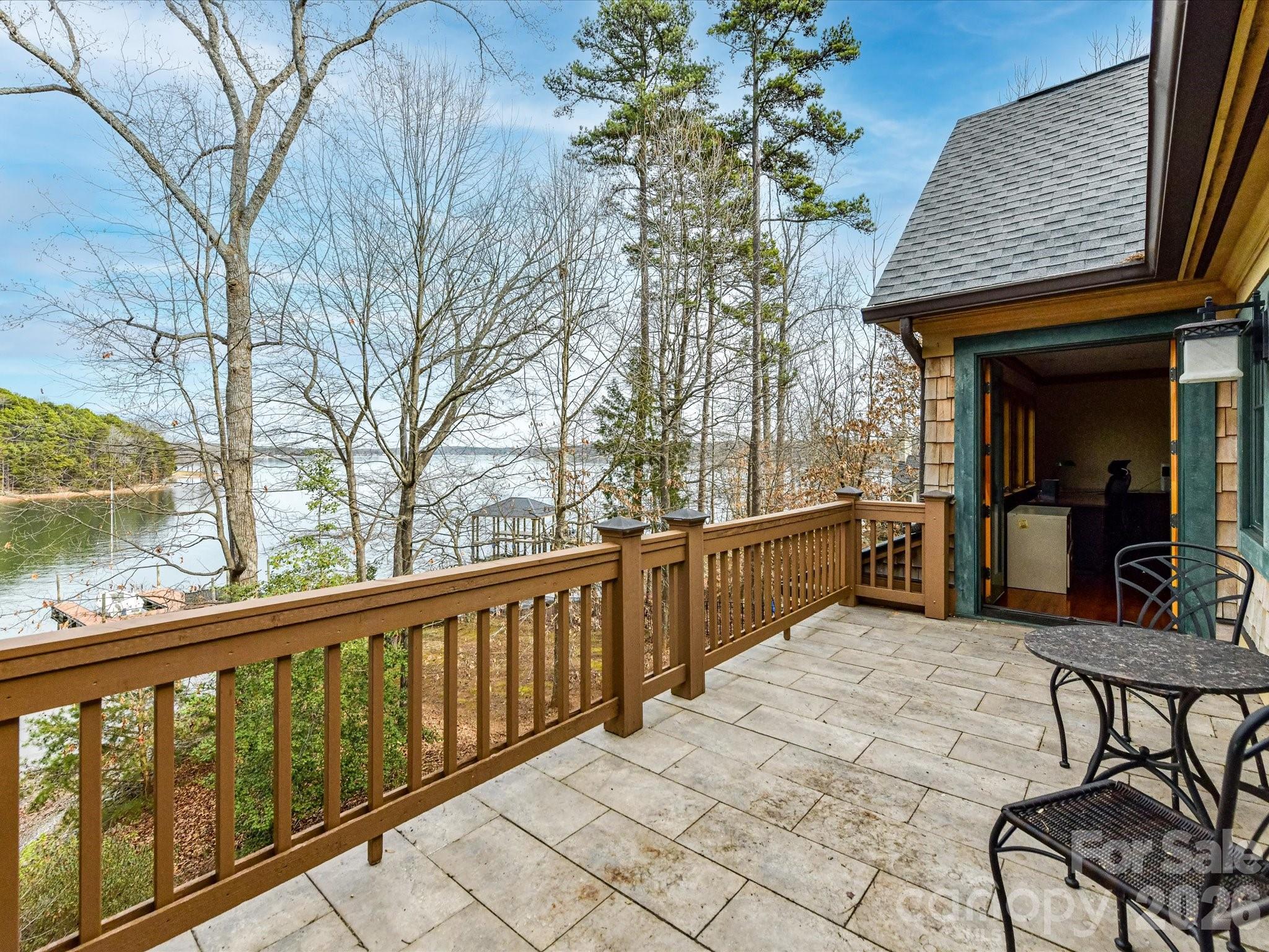 4312 Hazel Street Terrell, NC 28682 - Photo 27 of 45 a view of a patio with table and chairs and wooden floor