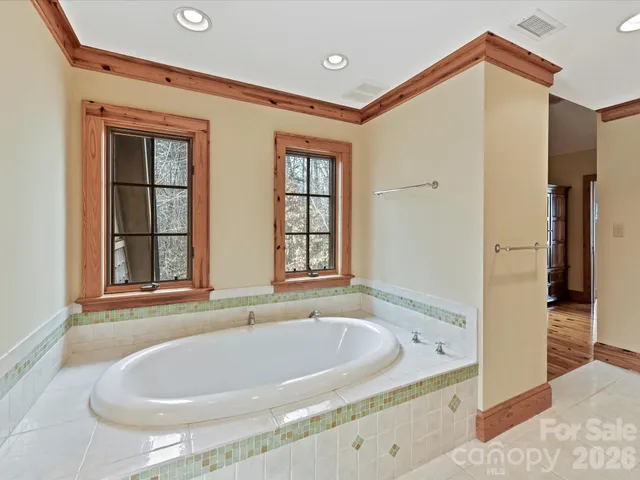 a view of hallway with granite countertop a stove and a refrigerator