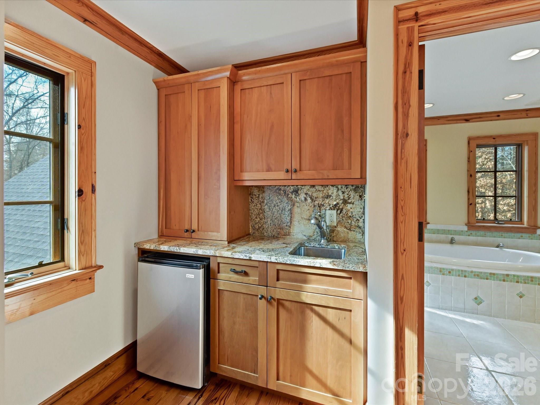 4312 Hazel Street Terrell, NC 28682 - Photo 32 of 45 a kitchen with stainless steel appliances granite countertop a stove and a refrigerator