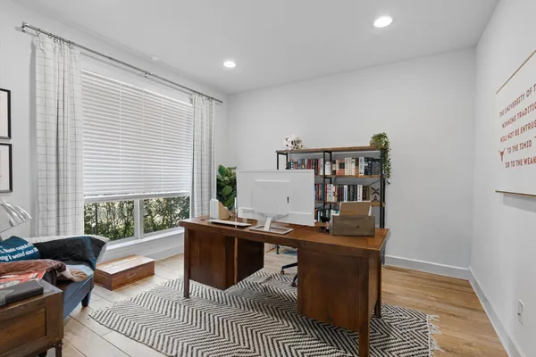 a work room with furniture and windows