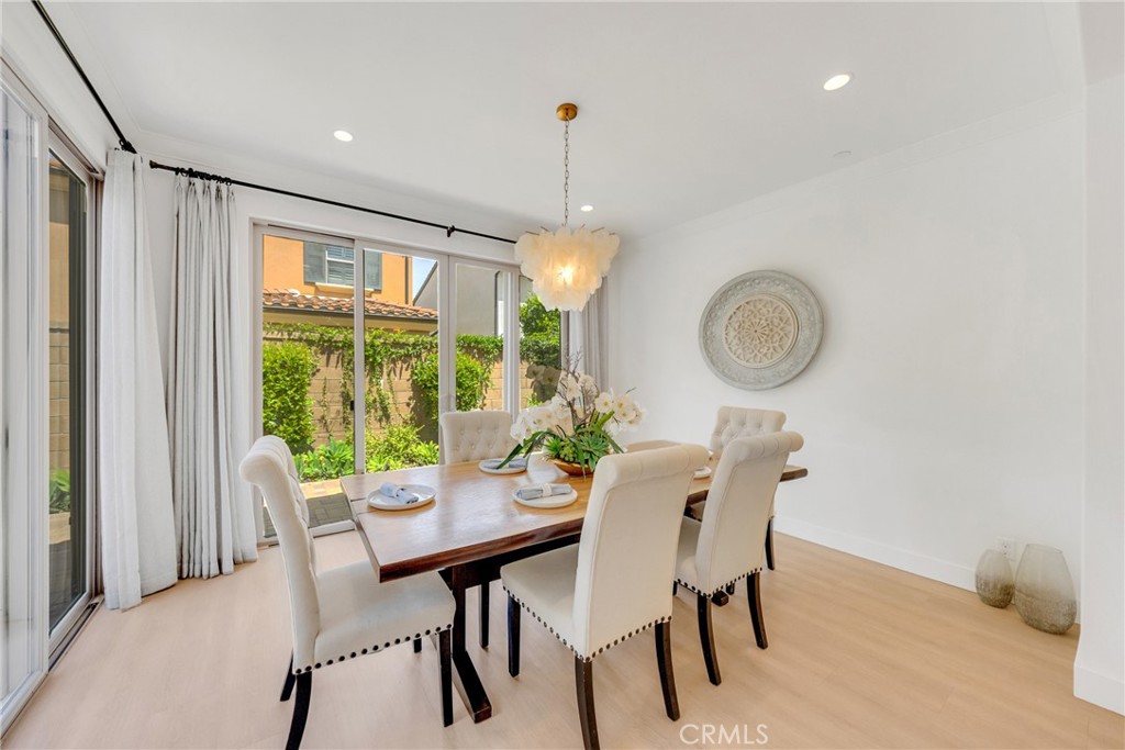 182 Frontier Irvine, CA 92620 - Photo 18 of 41 a dining room with furniture a chandelier and a window