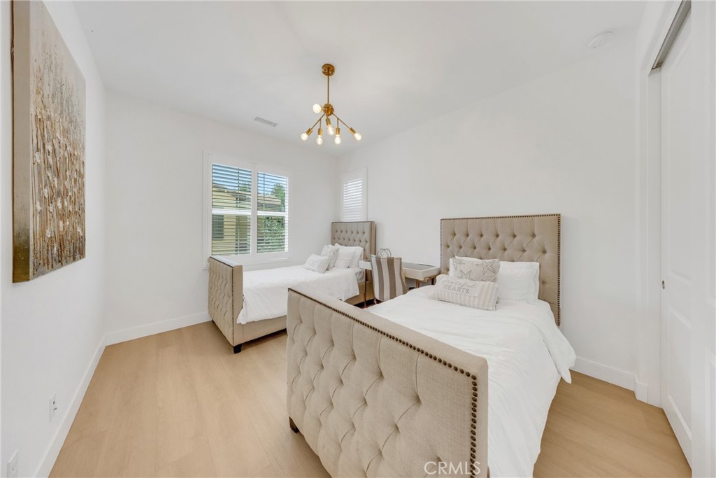 182 Frontier Irvine, CA 92620 - Photo 26 of 41 a bedroom with a bed and window