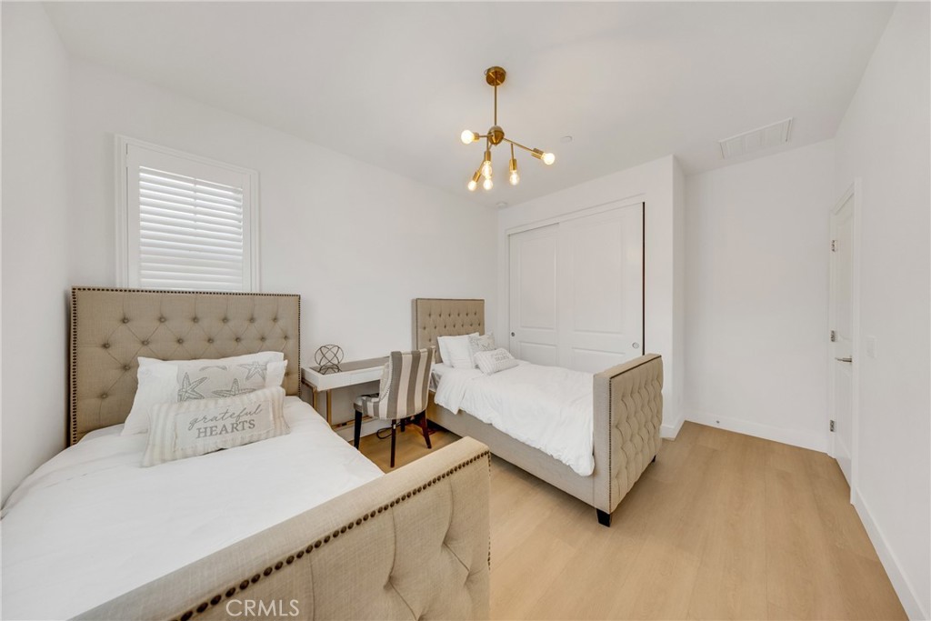 182 Frontier Irvine, CA 92620 - Photo 27 of 41 a bedroom with bed and window