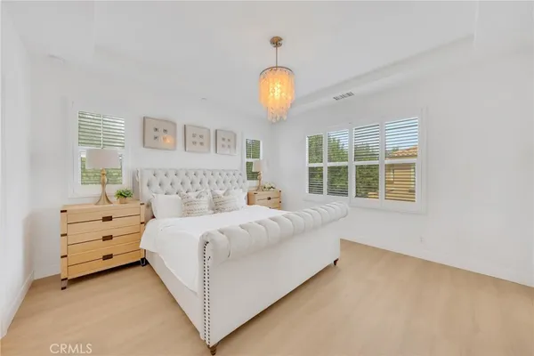 a bedroom with bed and a window