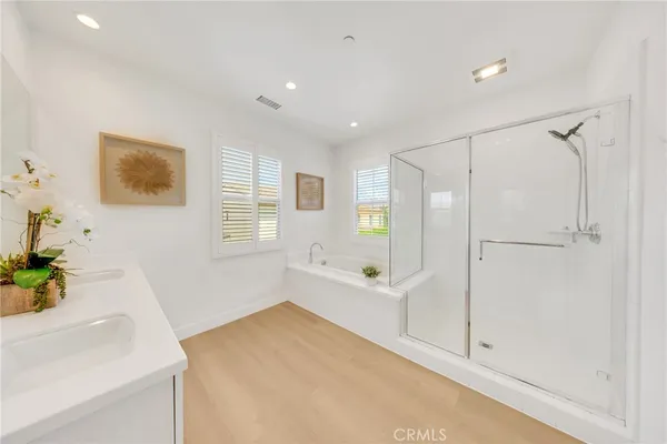 a bathroom with a bathtub and a shower