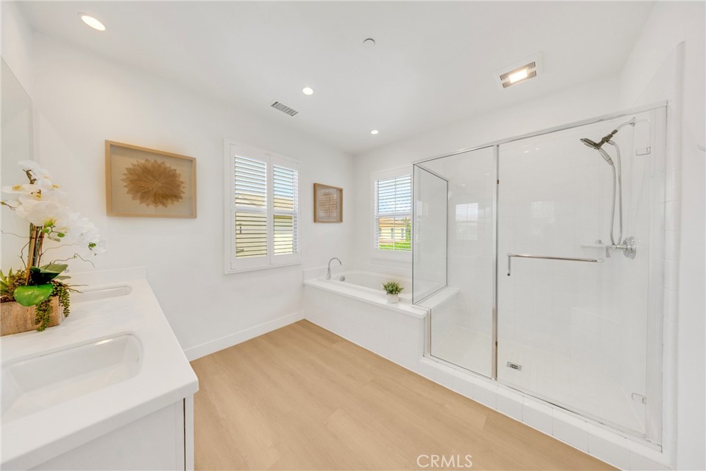 182 Frontier Irvine, CA 92620 - Photo 30 of 41 a bathroom with a bathtub and a shower