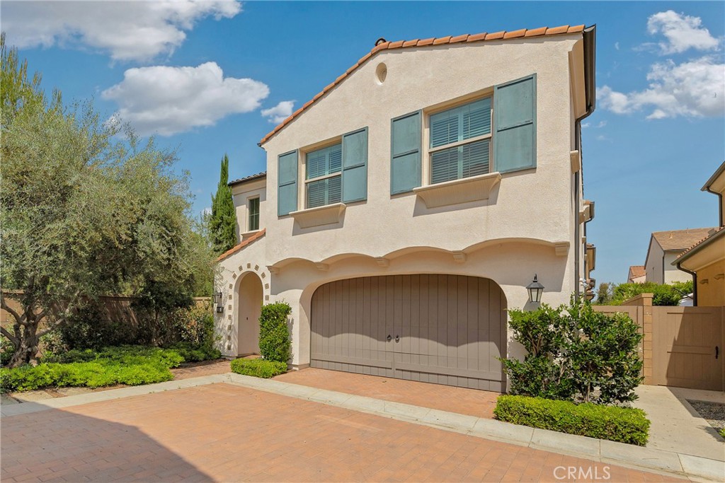 182 Frontier Irvine, CA 92620 - Photo 3 of 41 a front view of a house with a yard and garage
