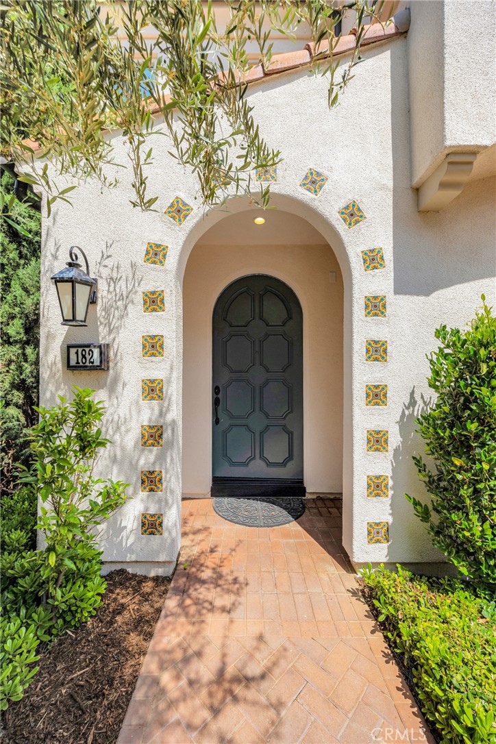 182 Frontier Irvine, CA 92620 - Photo 4 of 41 a front view of a house with a garden