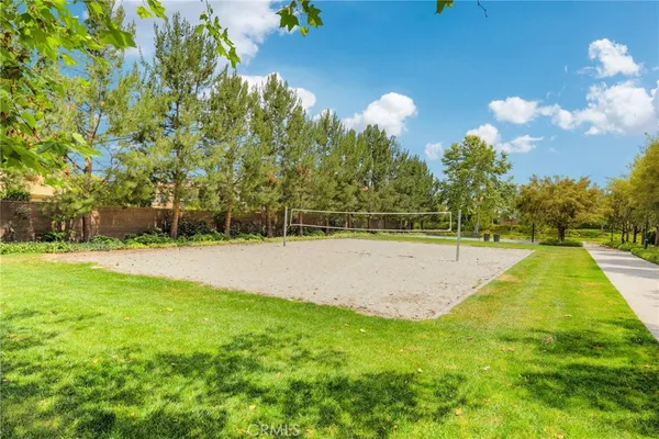 a view of a swimming pool with a yard