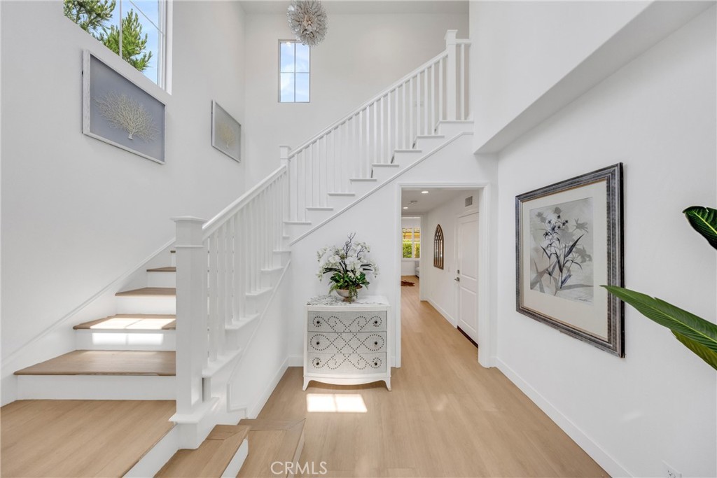 182 Frontier Irvine, CA 92620 - Photo 6 of 41 a view of entryway and hall with wooden floor