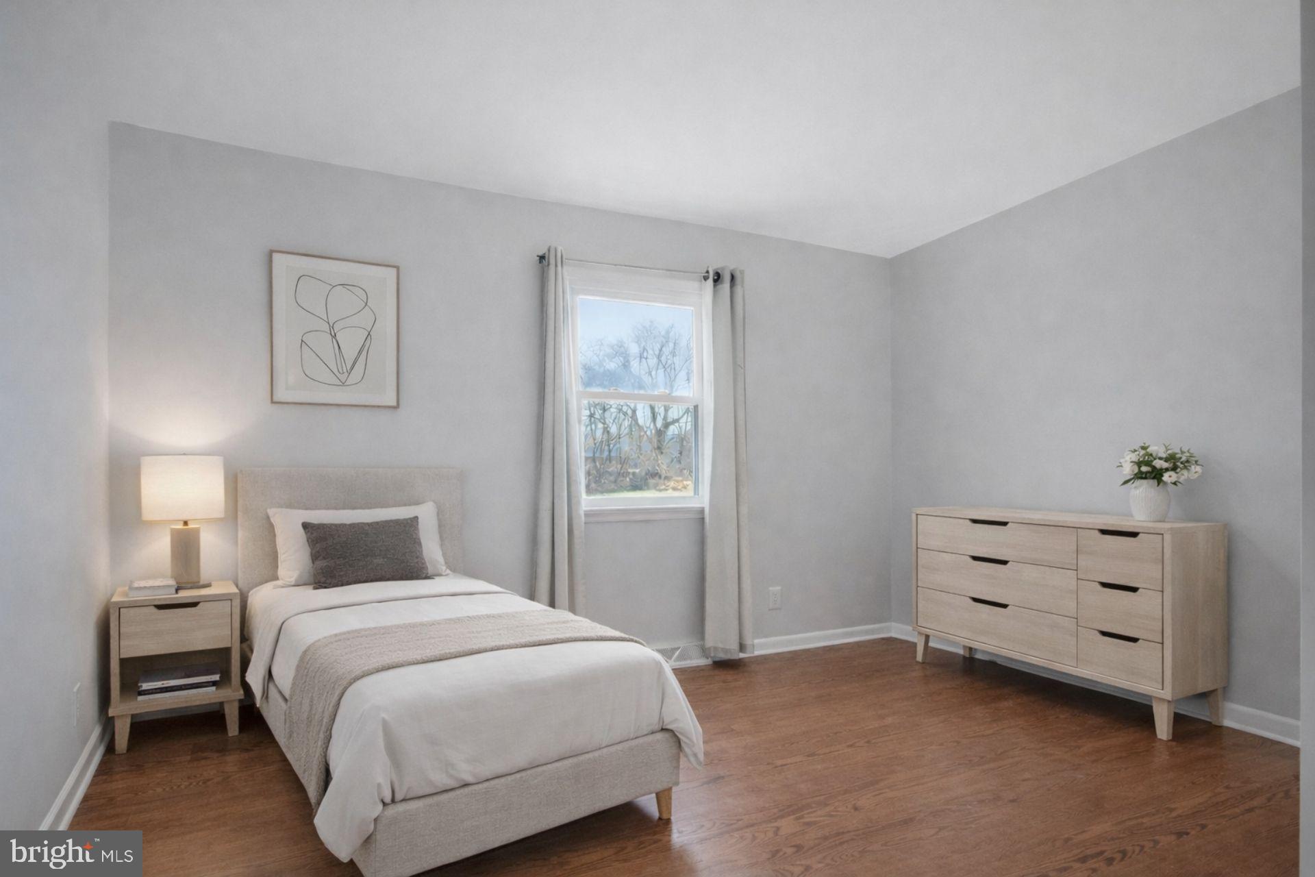 5967 Brooks Woods Road Lothian, MD 20711 - Photo 11 of 15 a bedroom with a bed and a window