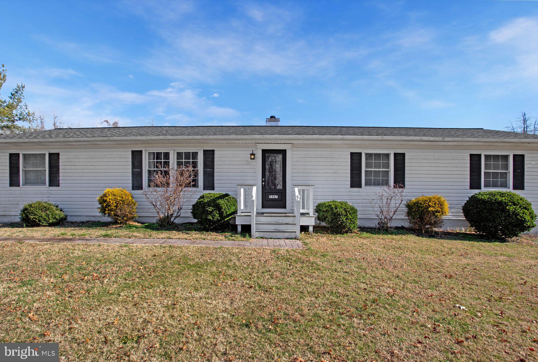 5967 Brooks Woods Road Lothian, MD 20711 - Photo 15 of 15 a view of a house with backyard and porch
