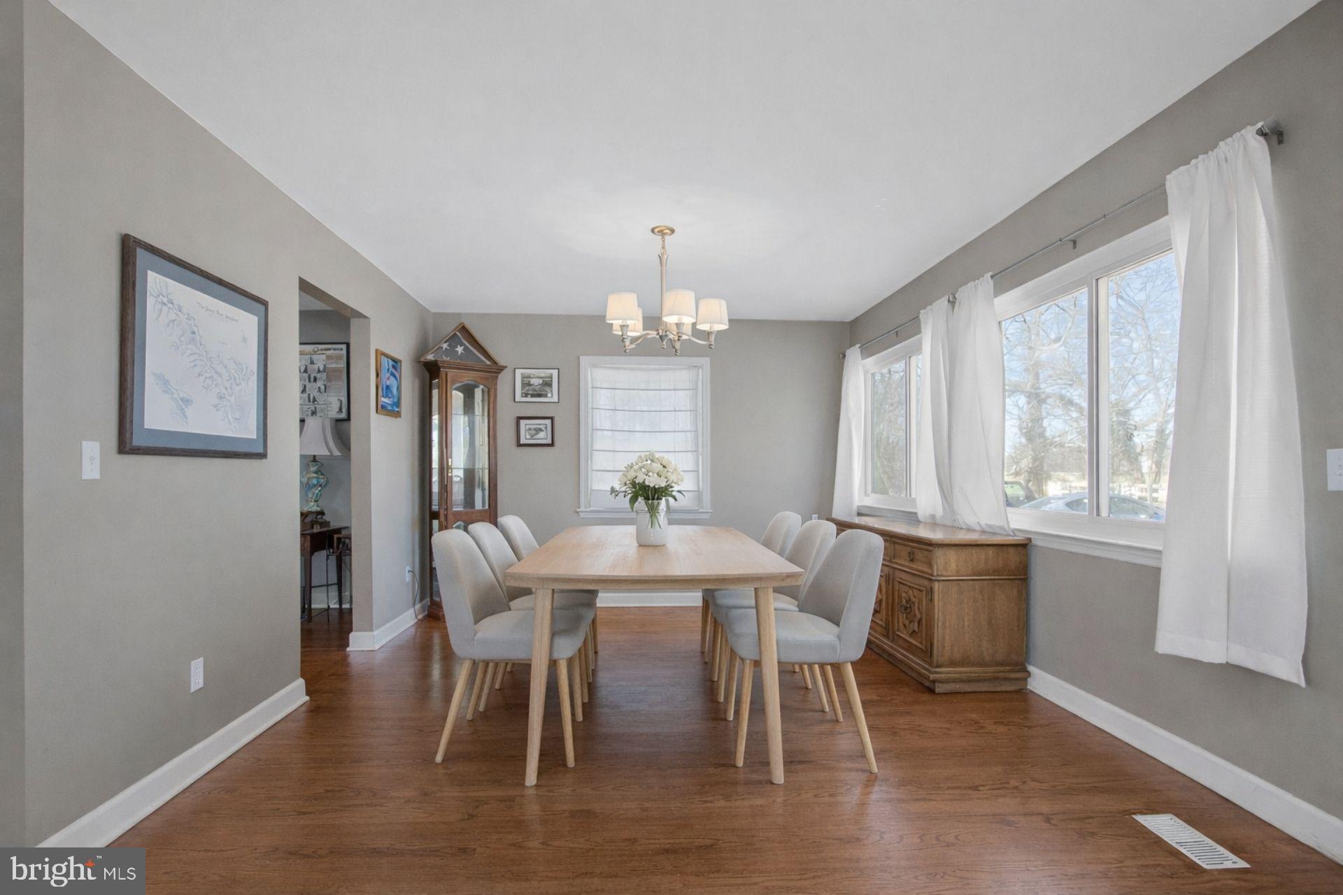 5967 Brooks Woods Road Lothian, MD 20711 - Photo 3 of 15 a view of a dining room with furniture window and wooden floor