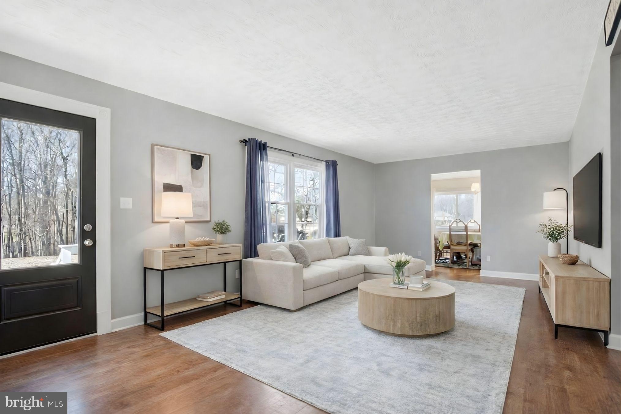 5967 Brooks Woods Road Lothian, MD 20711 - Photo 4 of 15 a living room with furniture and a flat screen tv