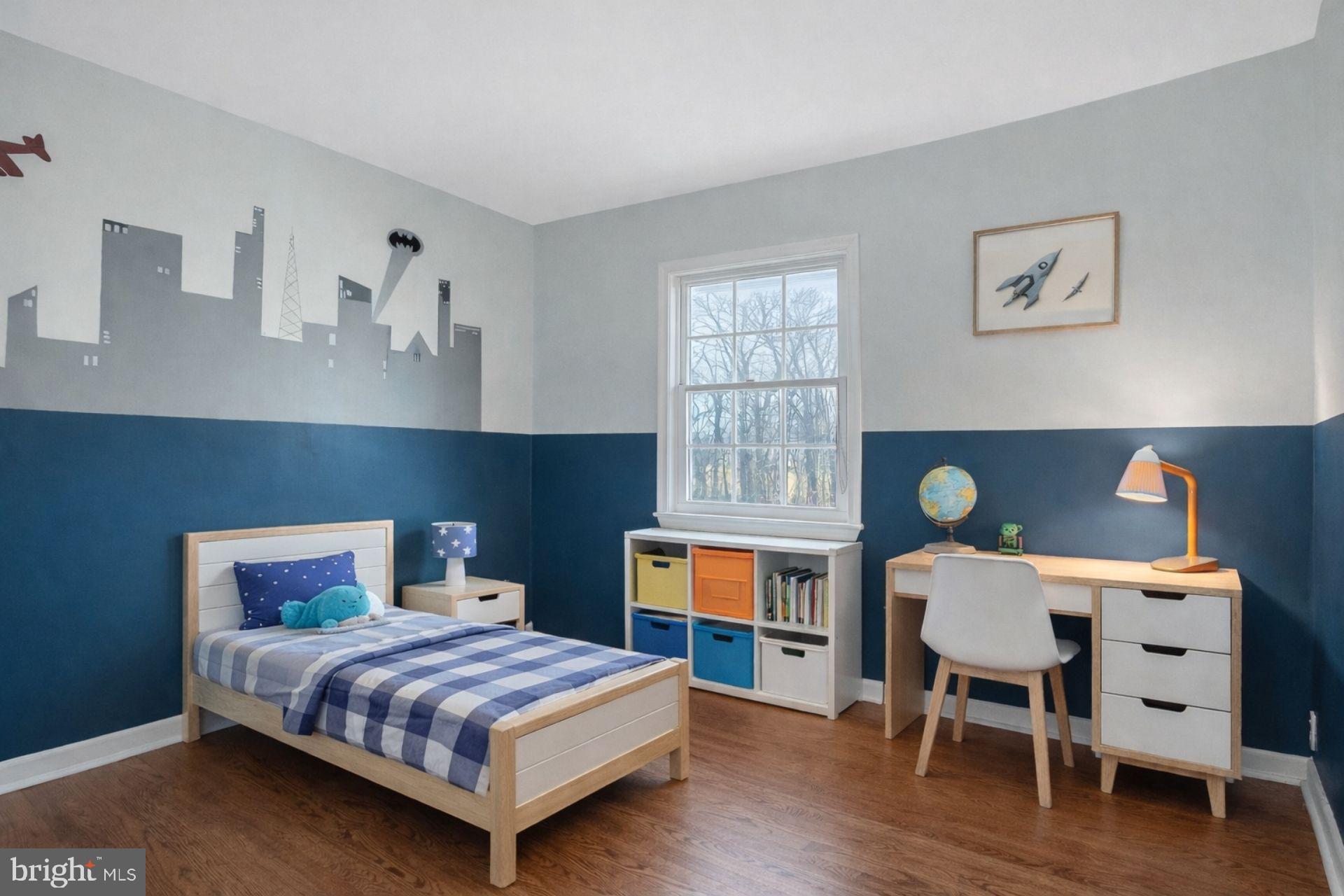 5967 Brooks Woods Road Lothian, MD 20711 - Photo 9 of 15 a bedroom with a bed and a bookshelf
