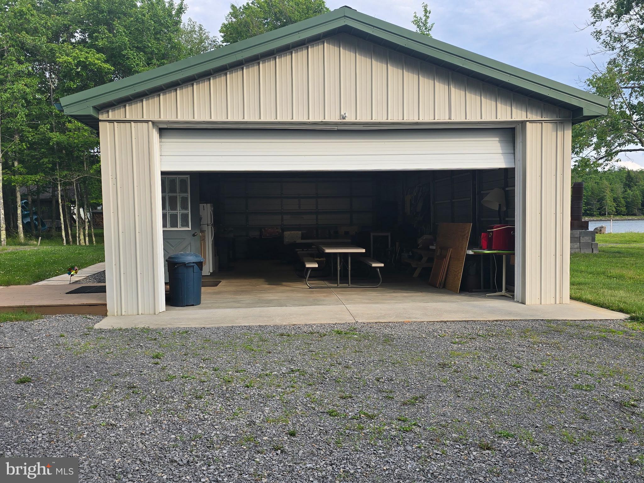 700 Paul Stahl Road Mount Storm, WV 26739 - Photo 19 of 31 Spacious garage with serene backdrop.