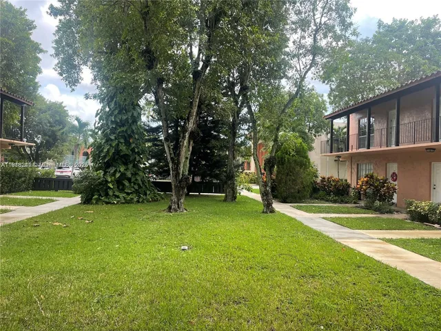 a view of a trees in front of a house