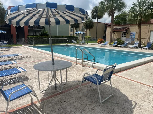 a patio with a table and chairs