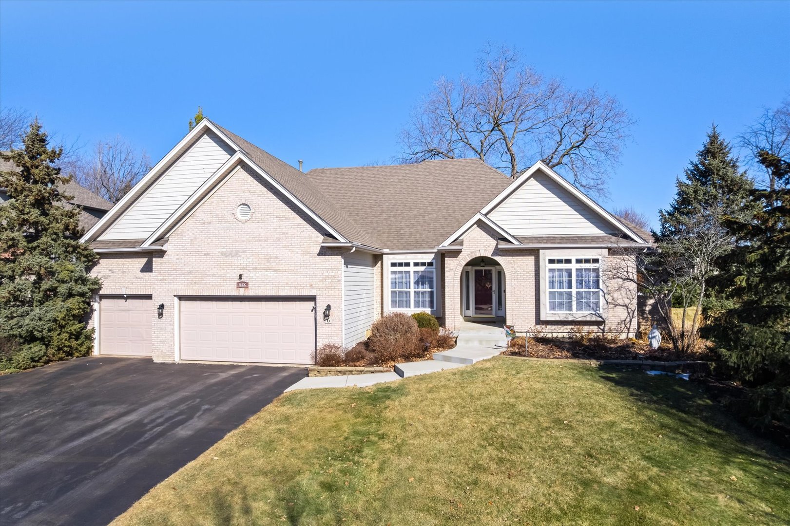 6 Winthrop New Road Sugar Grove, IL 60554 - Photo 1 of 38 a front view of a house with a yard and garage