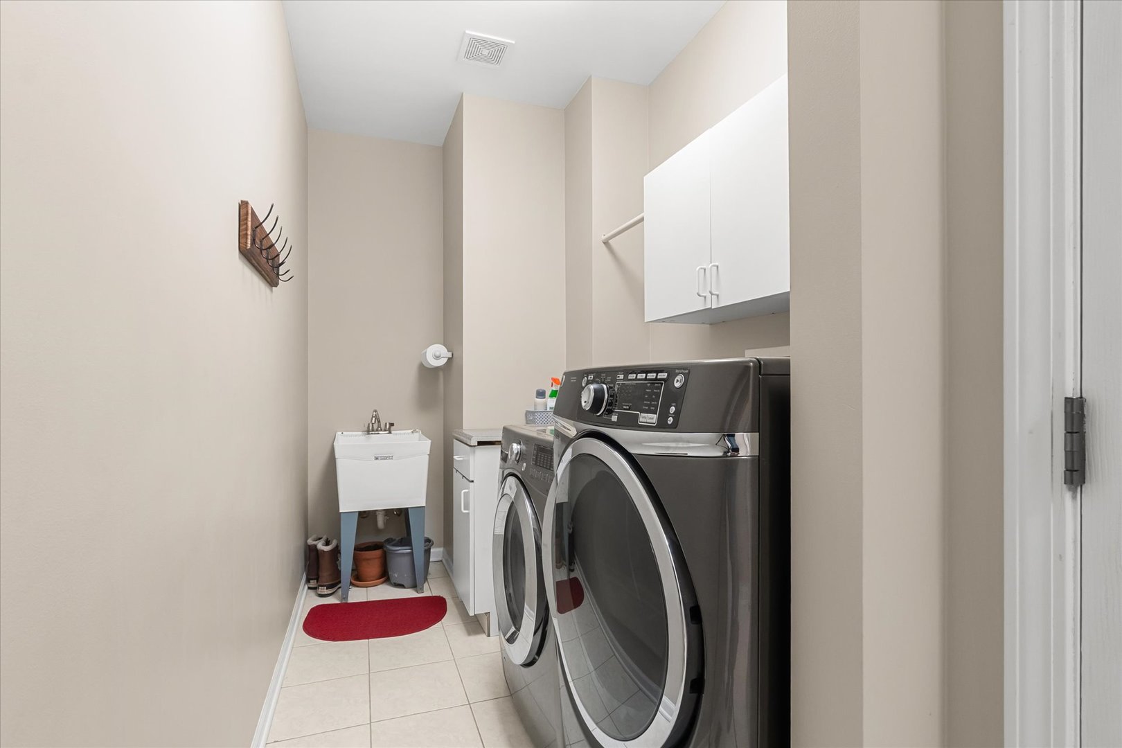 6 Winthrop New Road Sugar Grove, IL 60554 - Photo 12 of 38 a view of a storage and utility room with washer and dryer