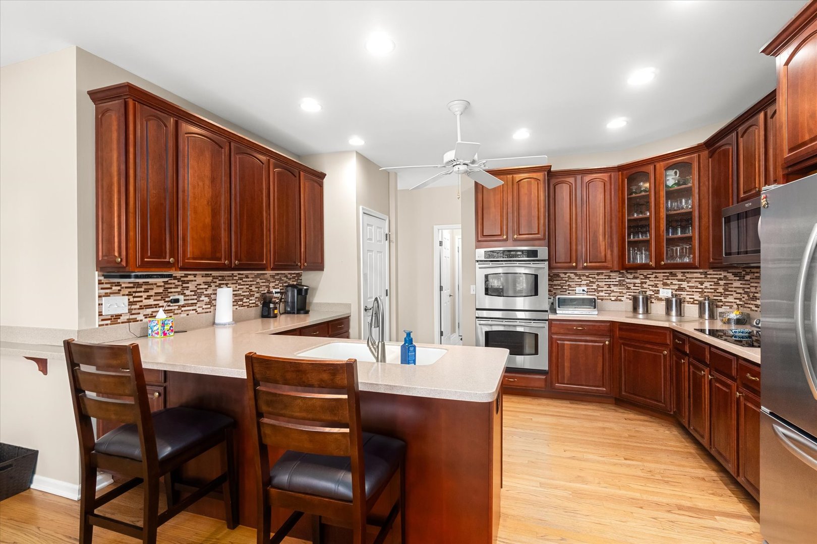 6 Winthrop New Road Sugar Grove, IL 60554 - Photo 8 of 38 a kitchen with stainless steel appliances kitchen island granite countertop a sink and cabinets