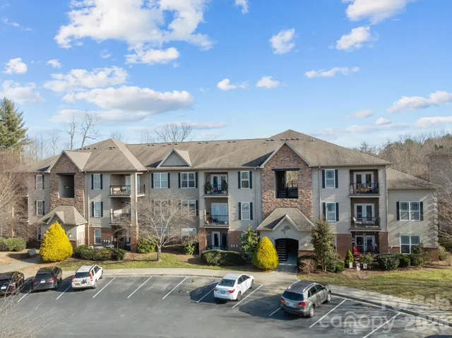 a view of a parked cars in front of a house