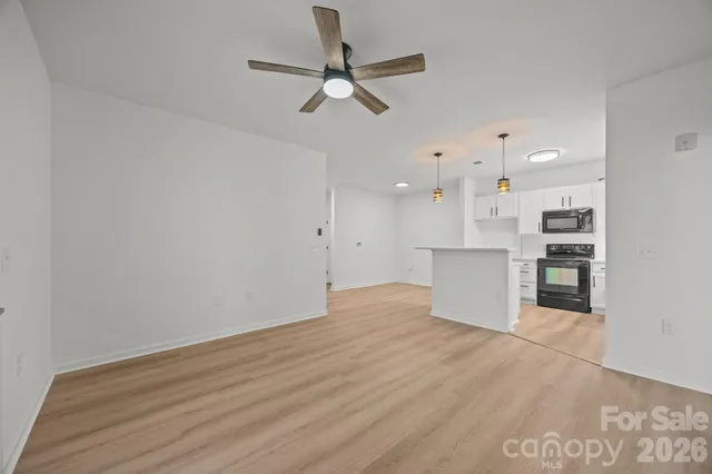 a view of kitchen with wooden floor