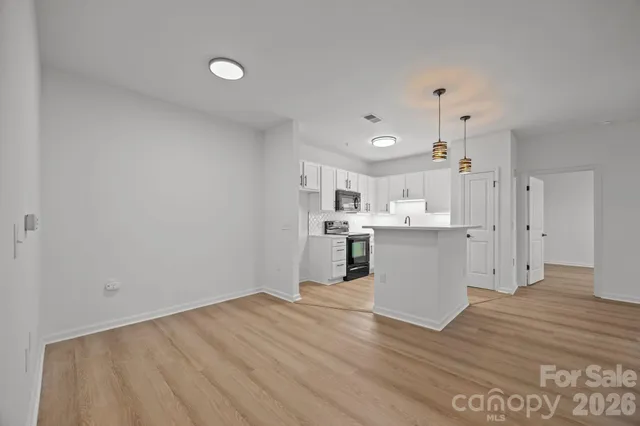 a view of kitchen with wooden floor