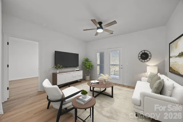 a living room with furniture and a flat screen tv