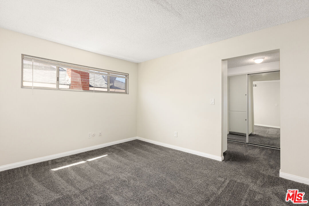 19115 Nestor Avenue Carson, CA 90746 - Photo 9 of 22 a view of an empty room with a window