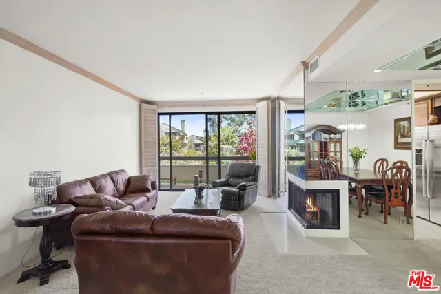 a spacious bedroom with a large bed and a window
