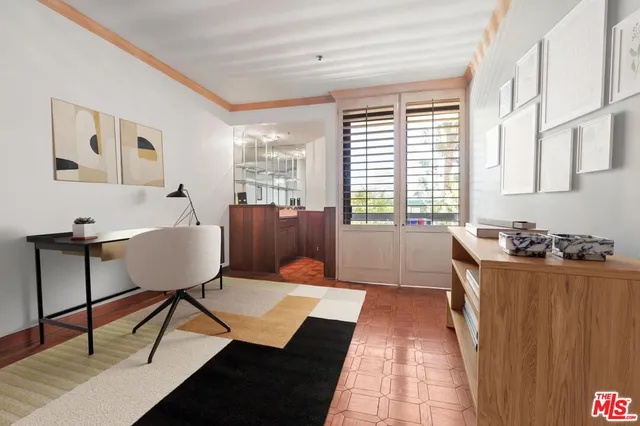 a bedroom with a bed and a night stand