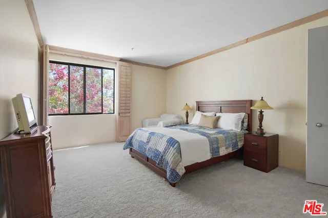 a white toilet sitting next to a bath tub
