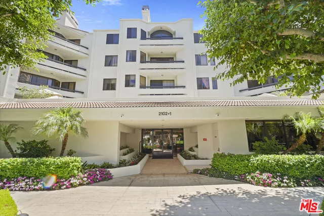 a sign that is in front of flowers