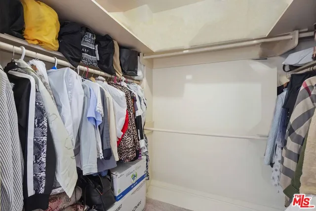 a bedroom with a bed and closet