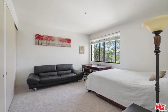 a bathroom with a shower and a glass door