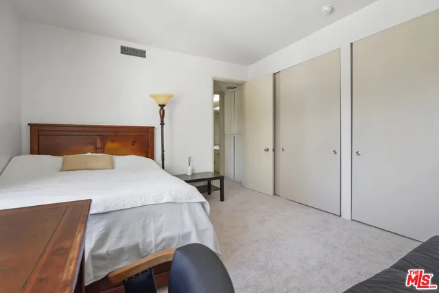a view of a livingroom with furniture and a window