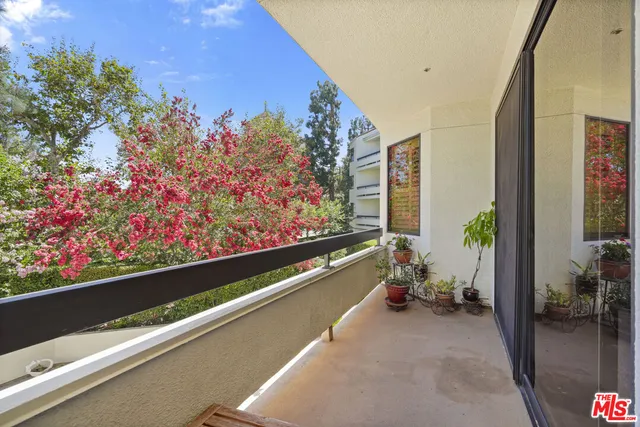 a view of a kitchen area with furniture and windows