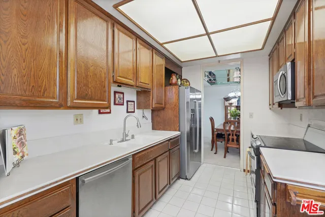 a view of a patio with wooden floor table and chairs