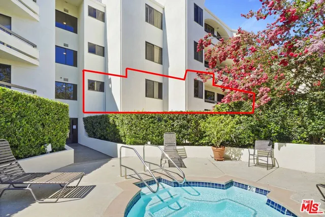 a view of a backyard with chairs