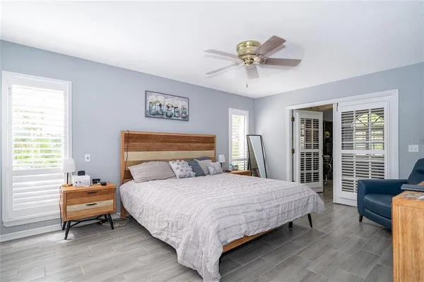 a bedroom with a bed and a couch