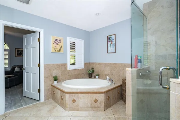 a bathroom with a tub and sink