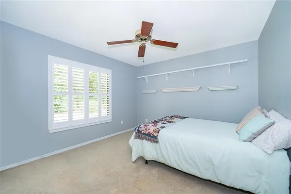 a bedroom with a bed and window