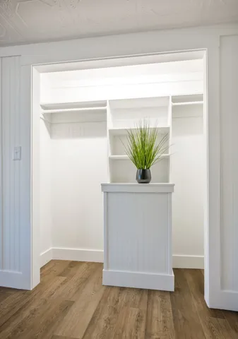 a bedroom with a large bed and a window