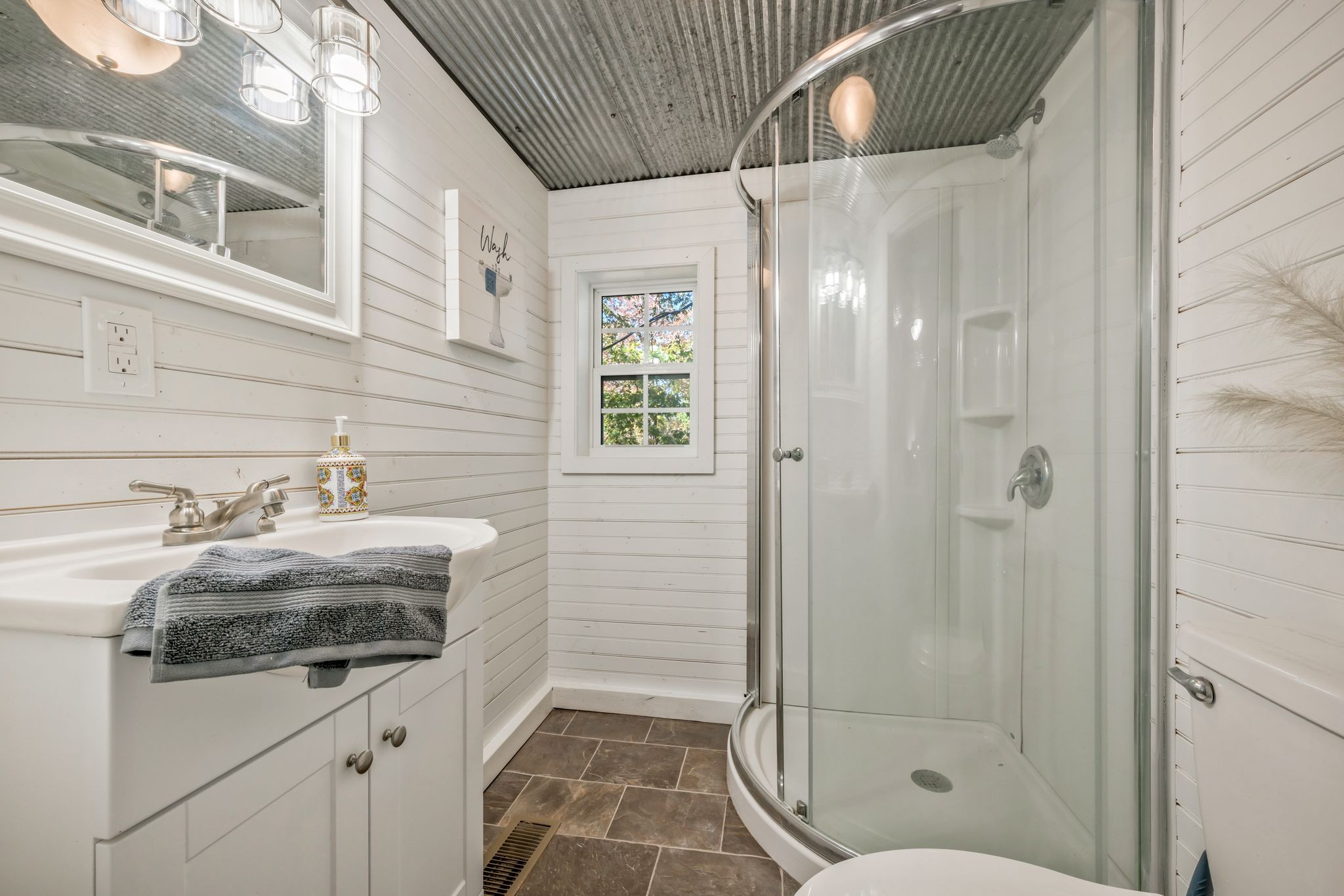 1865 Clydeton Road Waverly, TN 37185 - Photo 21 of 40 a bathroom with a granite countertop sink a toilet and shower