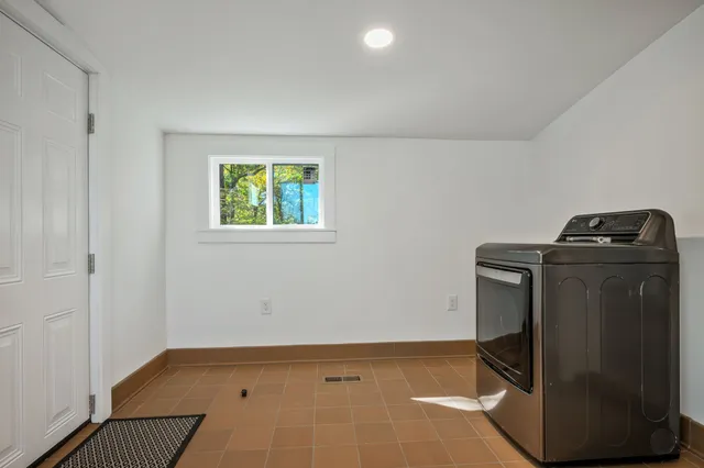 a house with swimming pool in front of it